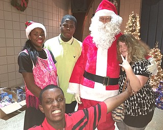 The Youngstown Lions Club hosted its 97th annual Christmas party for visually impaired and special needs kids Dec. 5 at the Saxon Club. More than 100 children received a turkey dinner and gifts from Santa. A DJ provided dance music, and Lions Club members served guests and distributed presents. The club raises money for the event through its annual Turtle Derby in June. Students participated from Chaney and East high schools, Volney Rogers, McGuffey and Williamson elementary schools, Leonard Kirtz School and South Side Academy.

