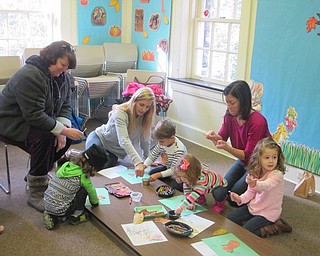 Neighbors | Zack Shively.The children at the Ford Nature Center's "In a Nutshell" program did a craft where they pasted a paper cut-out of a squirrel onto a page. They glued leaves to on the page to give the squirrel a colorful tail. Finally, they pasted an acorn into the squirrel's hands.