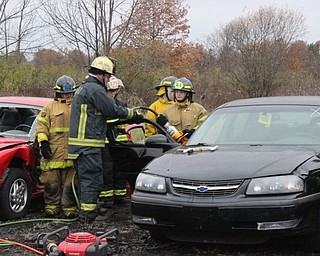 Neighbors | Abby Slanker.A Mahoning County Career and Technical Center Public Safety Program senior student listened to the instructor as he explained how to use the Jaws of Life on Nov. 16.