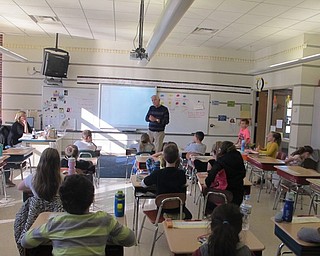 Neighbors | Zack Shively.Ron Saffell's grandchildren go to the Poland schools. He teaches French in their classes a couple times a year. He also teaches classes at St. Rose Catholic Church in Girard.