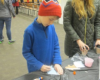 Neighbors | Zack Shively.The Poland library had crafts for children to complete during the Lighting of the Village event on Dec. 2. On one side of the room, they made Christmas ornaments. On the other side of the room, they made gingerbread men in mugs of hot cocoa.