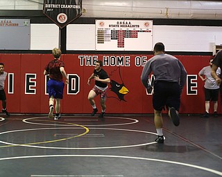 Tyler Stein runs sprints during a regular season practice, Wednesday, Dec. 13, 2017, at Canfield High school in Canfield...(Nikos Frazier | The Vindicator)