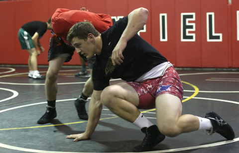 Tyler Stein works out with David Reinhart during a regular season practice, Wednesday, Dec. 13, 2017, at Canfield High school in Canfield...(Nikos Frazier | The Vindicator)