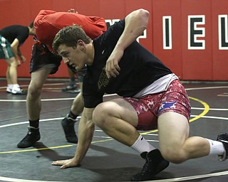 Tyler Stein works out with David Reinhart during a regular season practice, Wednesday, Dec. 13, 2017, at Canfield High school in Canfield...(Nikos Frazier | The Vindicator)