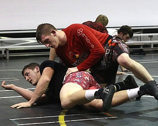 Tyler Stein works out with David Reinhart during a regular season practice, Wednesday, Dec. 13, 2017, at Canfield High school in Canfield...(Nikos Frazier | The Vindicator)
