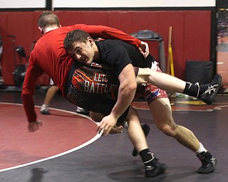 Tyler Stein works out with David Reinhart during a regular season practice, Wednesday, Dec. 13, 2017, at Canfield High school in Canfield...(Nikos Frazier | The Vindicator)