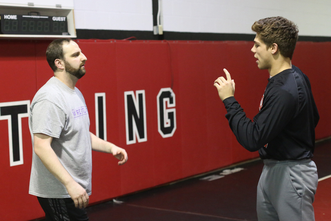 Anthony D'Alesio talks with coach Stephen Pitts during a regular season practice, Wednesday, Dec. 13, 2017, at Canfield High school in Canfield...(Nikos Frazier | The Vindicator)