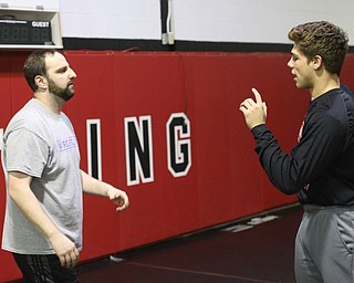 Anthony D'Alesio talks with coach Stephen Pitts during a regular season practice, Wednesday, Dec. 13, 2017, at Canfield High school in Canfield...(Nikos Frazier | The Vindicator)