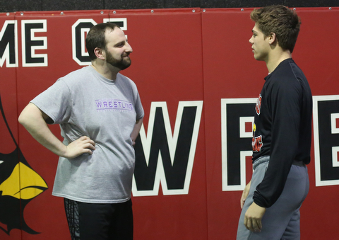 Anthony D'Alesio talks with coach Stephen Pitts during a regular season practice, Wednesday, Dec. 13, 2017, at Canfield High school in Canfield...(Nikos Frazier | The Vindicator)