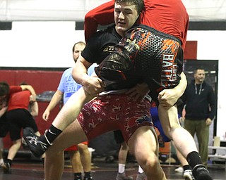 Tyler Stein works out with David Reinhart during a regular season practice, Wednesday, Dec. 13, 2017, at Canfield High school in Canfield...(Nikos Frazier | The Vindicator)