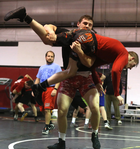 Tyler Stein works out with David Reinhart during a regular season practice, Wednesday, Dec. 13, 2017, at Canfield High school in Canfield...(Nikos Frazier | The Vindicator)