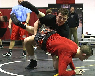Tyler Stein works out with David Reinhart during a regular season practice, Wednesday, Dec. 13, 2017, at Canfield High school in Canfield...(Nikos Frazier | The Vindicator)