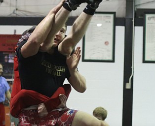 Tyler Stein works out with David Reinhart during a regular season practice, Wednesday, Dec. 13, 2017, at Canfield High school in Canfield...(Nikos Frazier | The Vindicator)