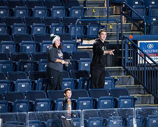 Scott R. Galvin | The Vindicator.Youngstown Phantoms fans throw pucks on the ice for the chuck-a-puck contest in the second intermission during the School Day Game against the Cedar Rapid RoughRiders on Thursday, Dec. 14, 2017 at the Covelli Centre.