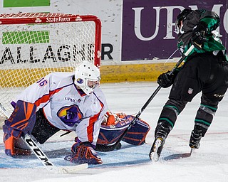 Scott R. Galvin | The Vindicator.Youngstown Phantoms goalie Wouter Peeters (36) makes a save during an overtime shootout from a shot by Cedar Rapids RoughRiders forward Marc McLaughlin on Thursday, December 14, 2017 at the Covelli Centre.