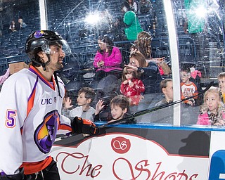 Scott R. Galvin | The Vindicator.Youngstown Phantoms defenseman Andrew Petrillo (5) taps the glass as fans congratulate the team on their shootout victory against the Cedar Rapid RoughRiders on Thursday, Dec. 14, 2017 at the Covelli Centre.