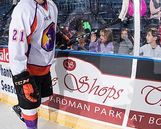 Scott R. Galvin | The Vindicator.Youngstown Phantoms center Mike Regush (21) taps the glass as fans congratulate the team on their shootout victory against the Cedar Rapid RoughRiders on Thursday, Dec. 14, 2017 at the the Covelli Centre.