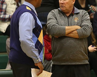 Ursuline head coach Keith Gunther and South Range head coach John Cullen talks before the first quarter of a high school basketball game, Friday, Dec. 15, 2017, in Youngstown. South Range won 61-38...(Nikos Frazier | The Vindicator)