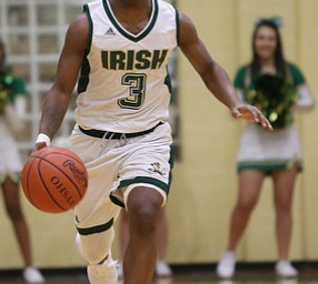 Ursuline point guard Braijon Nuby (3) drives towards the basket in the first quarter of a high school basketball game, Friday, Dec. 15, 2017, in Youngstown. South Range won 61-38...(Nikos Frazier | The Vindicator)