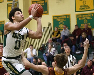 Ursuline forward Devan Keevey (0) goes up for a layup over South Range guard Nick Matos (22) in the first quarter of a high school basketball game, Friday, Dec. 15, 2017, in Youngstown. South Range won 61-38...(Nikos Frazier | The Vindicator)