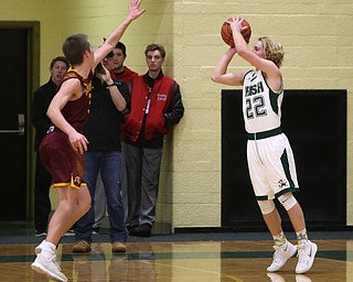 Ursuline guard Vincent Armeni (22) goes up for three in the second quarter of a high school basketball game, Friday, Dec. 15, 2017, in Youngstown. South Range won 61-38...(Nikos Frazier | The Vindicator)