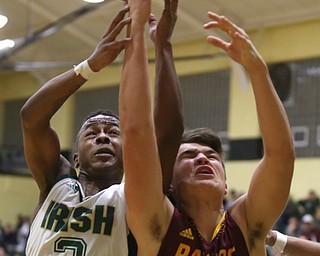Ursuline point guard Braijon Nuby (3) and South Range forward Jake Gehring (44) go for the rebound in the second quarter of a high school basketball game, Friday, Dec. 15, 2017, in Youngstown. South Range won 61-38...(Nikos Frazier | The Vindicator)