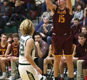 South Range guard Mike Cunningham (15) goes up for three in the fourth quarter of a high school basketball game, Friday, Dec. 15, 2017, in Youngstown. South Range won 61-38...(Nikos Frazier | The Vindicator)