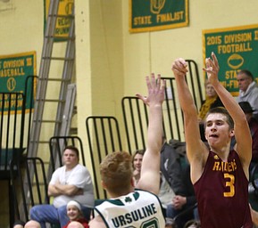 South Range guard Ben Irons (3) goes up for three as Ursuline guard Dylan Karlovic (23) attempts to block his shot in the fourth quarter of a high school basketball game, Friday, Dec. 15, 2017, in Youngstown. South Range won 61-38...(Nikos Frazier | The Vindicator)