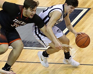 MCDONALD, OHIO - DECEMBER 15, 2017:  Springfield's Ben Chaszeylia (34) deturs McDonald's Zach Rasile (25) during the 1st qtr at McDonald High School.  MICHAEL G. TAYLOR | THE VINDICATOR