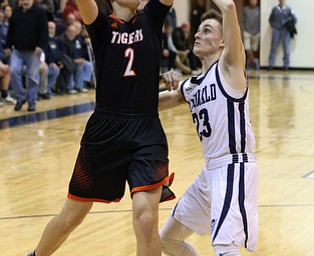 MCDONALD, OHIO - DECEMBER 15, 2017: Springfield's Drew Clerk (2) shoots over McDonald's Riko Rodriguez (23) during the 3rd qtr at McDonald High School.  MICHAEL G. TAYLOR | THE VINDICATOR