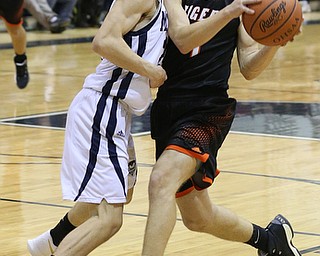 MCDONALD, OHIO - DECEMBER 15, 2017: Springfield's Evan Ohlin (1) drives to the hoop against McDonald's Zach Rasile (25) during the 3rd qtr at McDonald High School.  MICHAEL G. TAYLOR | THE VINDICATOR