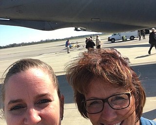 Jo Taylor, Brookfield superintendent, and Stacey Filicky, Brookfield Elementary School prinicipal, recently participated in the Rickenbacker Air National Guard “BossLift” in Columbus. A “BossLift” is an aerial refueling of a military aircraft. This one was done with Thunderbolt jets, while flying in a KC-135 Stratotanker as part of the 121st Air Refueling Wing training mission. The host for the day was retired U.S. Air Force Maj. Gen. Robert P. “Lance” Meyer, Jr. Above, from left, are Filicky and Taylor at the base in Columbus. The “BossLift” thanked the Brookfield School District for supporting the National Guard and Reserve during Brookfield Middle School teacher Steve Sambroak’s deployment to Afghanistan.