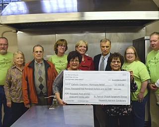 Volunteers from St. Patrick Church recently helped raise $3,500 to donate to the Catholic Charities hurricane relief fund. Proceeds from a spaghetti dinner, honey sale, and Heavenly Harvest Gardeners’ homemade beef vegetable soup sale went toward the donation. Above, front row from left, are Mary Ann Terlecky and Donna Mottram. In back row, from left, are Greg Davner, Ginny Hull, Tom Hull, Christine Silvestri, Ingrid Cassidy, Ed Palguta, Amy Best and Jeff Huzicka.