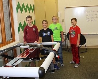 Students who maintained positive behavior in and out of the classroom at West Branch Middle School recently were rewarded with lunch in the Warrior Way Hard Work Cafe. The student Council purchased an air hockey table for use in the cafe this year. They also provide games, hot cocoa and a fun environment for fellow students. Above, from left, are Evan Hancock, Maddox Coleman, Lukas Richards and Noah Baird.
