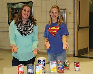 Above, West Branch Middle School student council members Peyton Bell, left, and Kennedy Close, invited fellow students, teachers, staff and community members to donate to its annual food drive, which took place from Nov. 9 through 17. The items will help needy families during the holiday season. Their goal was to collect more than 3,000 pounds.
