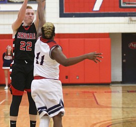 Canfield's guard Ian McGraw (22) goes up for three as Austintown Fitch guard Emaniel Dawkins (11) in the third quarter of an AAC high school basketball game, Saturday, Dec. 16, 2017, in Austintown. Canfield won 77-57...(Nikos Frazier | The Vindicator)
