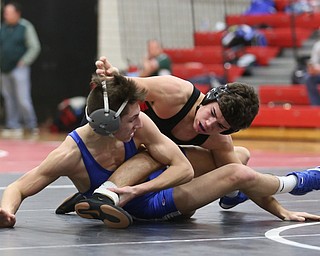 Canfield's McCoy Watkins(black) attempts to reach for Reynold's Rocco Bartolo(blue) during a OSHAA 132 pound wrestling tournament, Saturday, Dec. 16, 2017, in Canfield. ..(Nikos Frazier | The Vindicator)