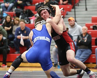 Canfield's Diovanni Dunlap(black) faces Reynold's Alex Ischo(blue) during a OSHAA 138 pound wrestling tournament, Saturday, Dec. 16, 2017, in Canfield. ..(Nikos Frazier | The Vindicator)