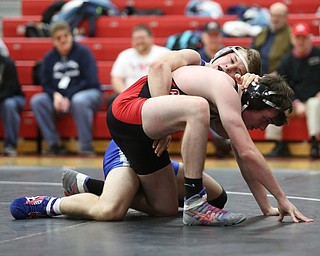 Reynold's Alex Ischo(blue) maintains his grip on Canfield's Diovanni Dunlap(black) during a OSHAA 138 pound wrestling tournament, Saturday, Dec. 16, 2017, in Canfield. ..(Nikos Frazier | The Vindicator)