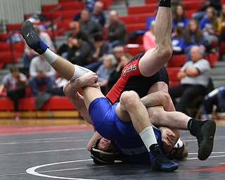 Canfield's David Reinhart(black) rolls over Reynold's Hunter Michaels(blue) during a OSHAA 152 pound wrestling tournament, Saturday, Dec. 16, 2017, in Canfield. ..(Nikos Frazier | The Vindicator)