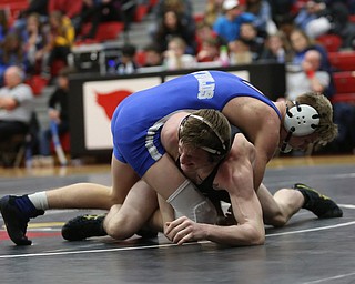 Canfield's David Reinhart(black) tries to escape Reynold's Hunter Michaels(blue) during a OSHAA 152 pound wrestling tournament, Saturday, Dec. 16, 2017, in Canfield. ..(Nikos Frazier | The Vindicator)