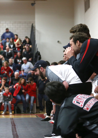 Canfield head coach Stephen Pitts calls out to a player during a OSHAA 152 pound wrestling tournament, Saturday, Dec. 16, 2017, in Canfield. ..(Nikos Frazier | The Vindicator)