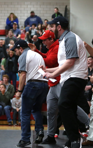 Canfield head coach Stephen Pitts calls out to a player during a OSHAA 152 pound wrestling tournament, Saturday, Dec. 16, 2017, in Canfield. ..(Nikos Frazier | The Vindicator)