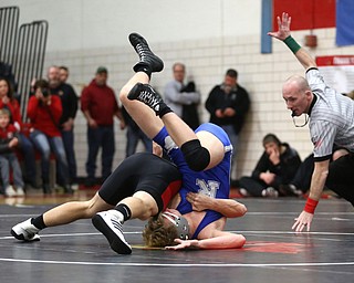 Canfield's Seth Hull(black) pins Reynold's Hunter Thompson(blue) to the mat during a OSHAA 160 pound wrestling tournament, Saturday, Dec. 16, 2017, in Canfield. ..(Nikos Frazier | The Vindicator)