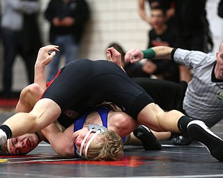 Canfield's Seth Hull(black) pins Reynold's Hunter Thompson(blue) to the mat during a OSHAA 160 pound wrestling tournament, Saturday, Dec. 16, 2017, in Canfield. ..(Nikos Frazier | The Vindicator)
