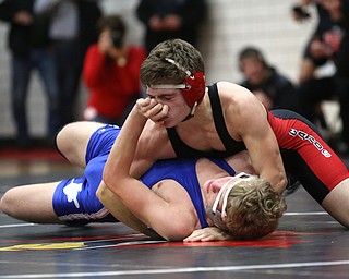 Canfield's Seth Hull(black) pins Reynold's Hunter Thompson(blue) to the mat during a OSHAA 160 pound wrestling tournament, Saturday, Dec. 16, 2017, in Canfield. ..(Nikos Frazier | The Vindicator)