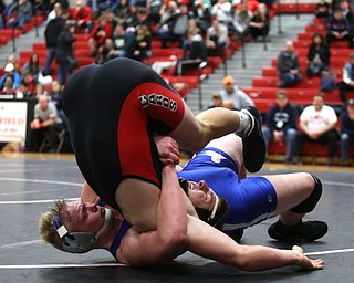Reynold's Xavier Coburn(blue) flips Canfield's Tyler Stein(black) during a OSHAA 220 pound wrestling tournament, Saturday, Dec. 16, 2017, in Canfield. ..(Nikos Frazier | The Vindicator)