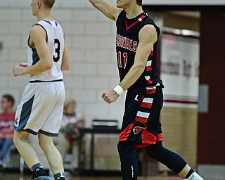 BOARDMAN, OHIO - DECEMBER 19, 2017: Canfield's Spencer Woolley celebrates after Boardman called a time out in attempt to stop a Canfield run during the second half of their game, Tuesday night at Boardman High School. DAVID DERMER | THE VINDICATOR..Boardman's Holden Lipke pictured.
