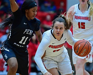 YOUNGSTOWN, OHIO - DECEMBER 20, 2017: Youngstown State's Josie Fisher drives on Penn State Beaver's Diamond Thomas during the first half of their game on Wednesday morning at Beeghley Center. DAVID DERMER | THE VINDICATOR