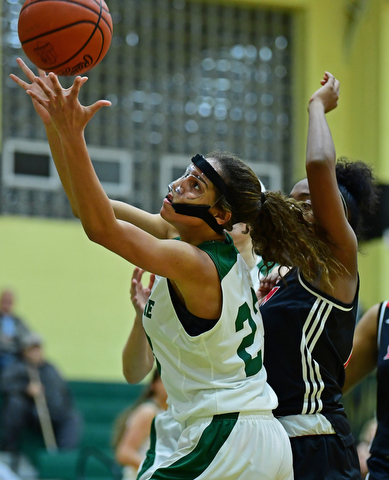 YOUNGSTOWN, OHIO - DECEMBER 20, 2017: Ursuline's Anisah Moorman grabs a rebound away from Shaw's Jasmine Manuel during the first half of their game, Tuesday night at Ursuline High School. DAVID DERMER | THE VINDICATOR